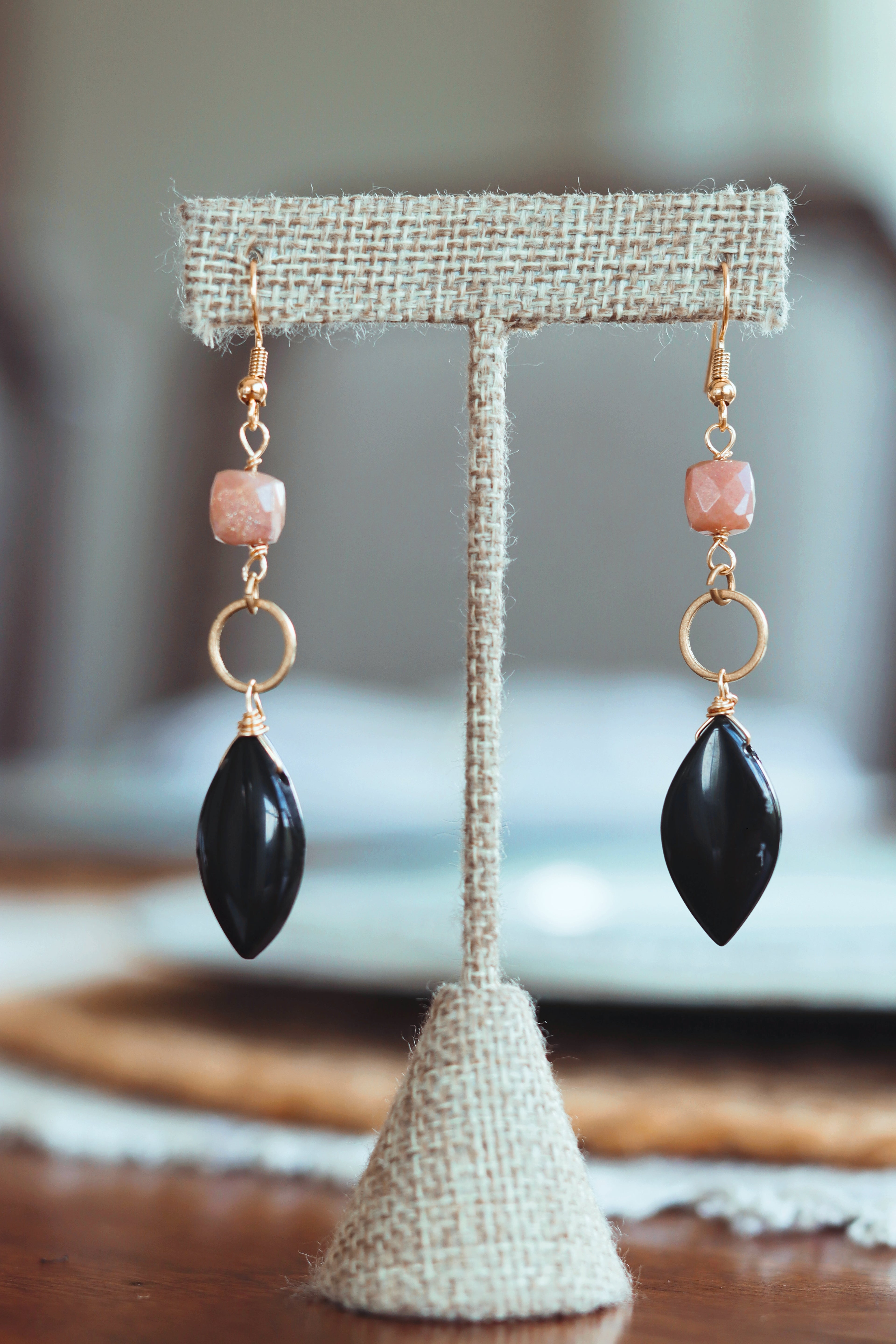 Onyx with brass circle and peach moonstone square